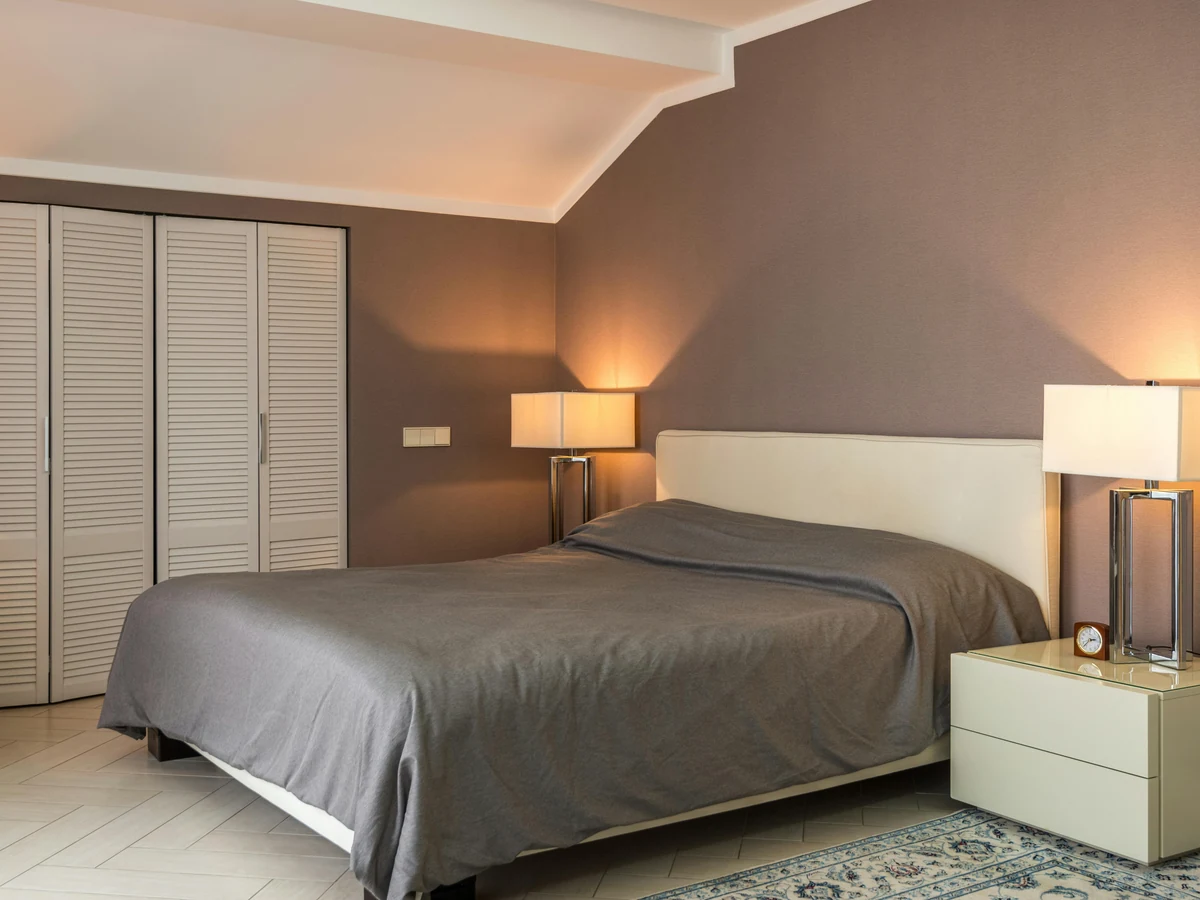 Cosy taupe bedroom painted by Surrey Decorators bedroom painting service
