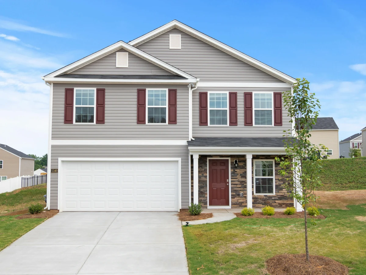 Suburban two-storey house exterior painting in Banstead by Surrey Decorators