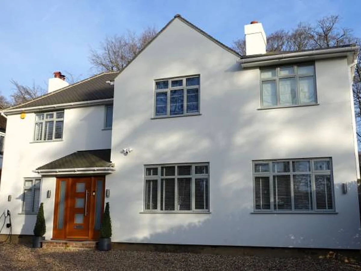 Exterior painting in Ewell, white rendered detached house finished by Surrey Decorators