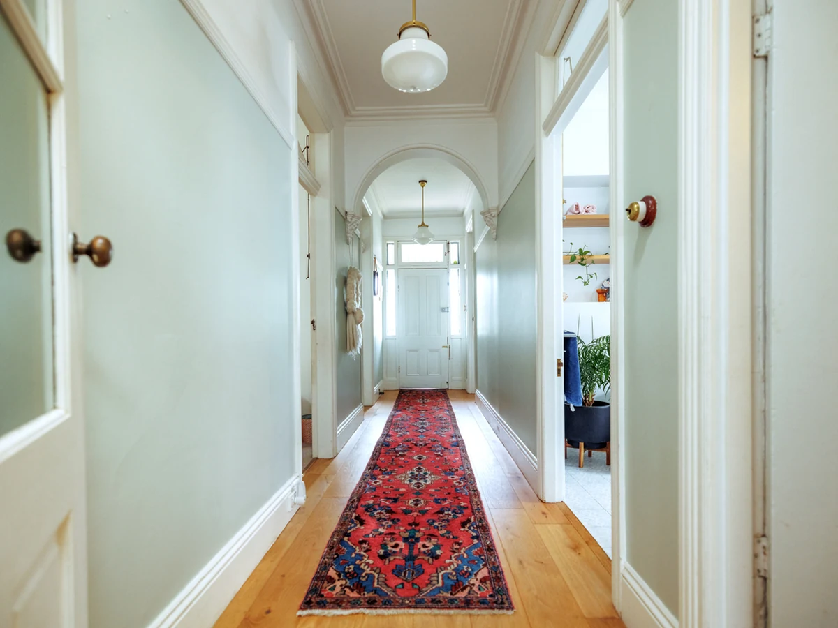 Light green Victorian hallway painting in Surrey by Surrey Decorators