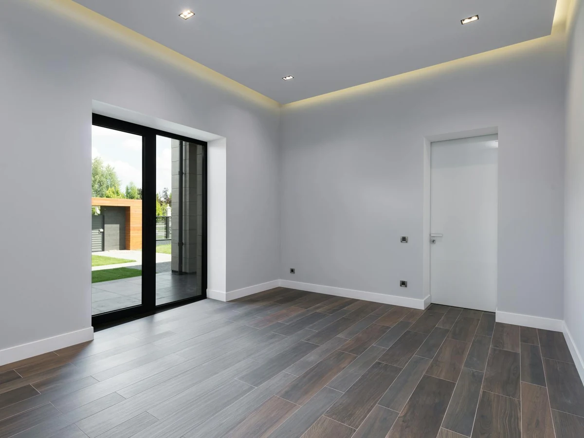 Interior painting of empty grey room in Egham by Surrey Decorators