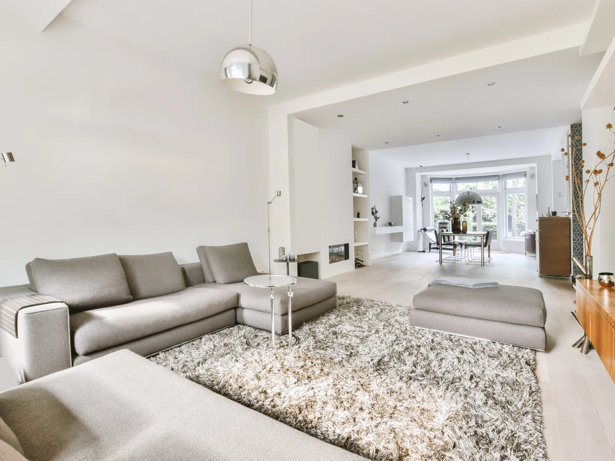 Open-plan living room painting in white for a West Molesey semi-detached home by Surrey Decorators