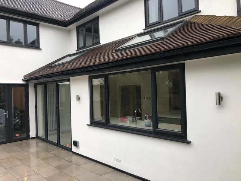 Painted white render and black frames by PA Painting & Decorating — Surrey Decorators